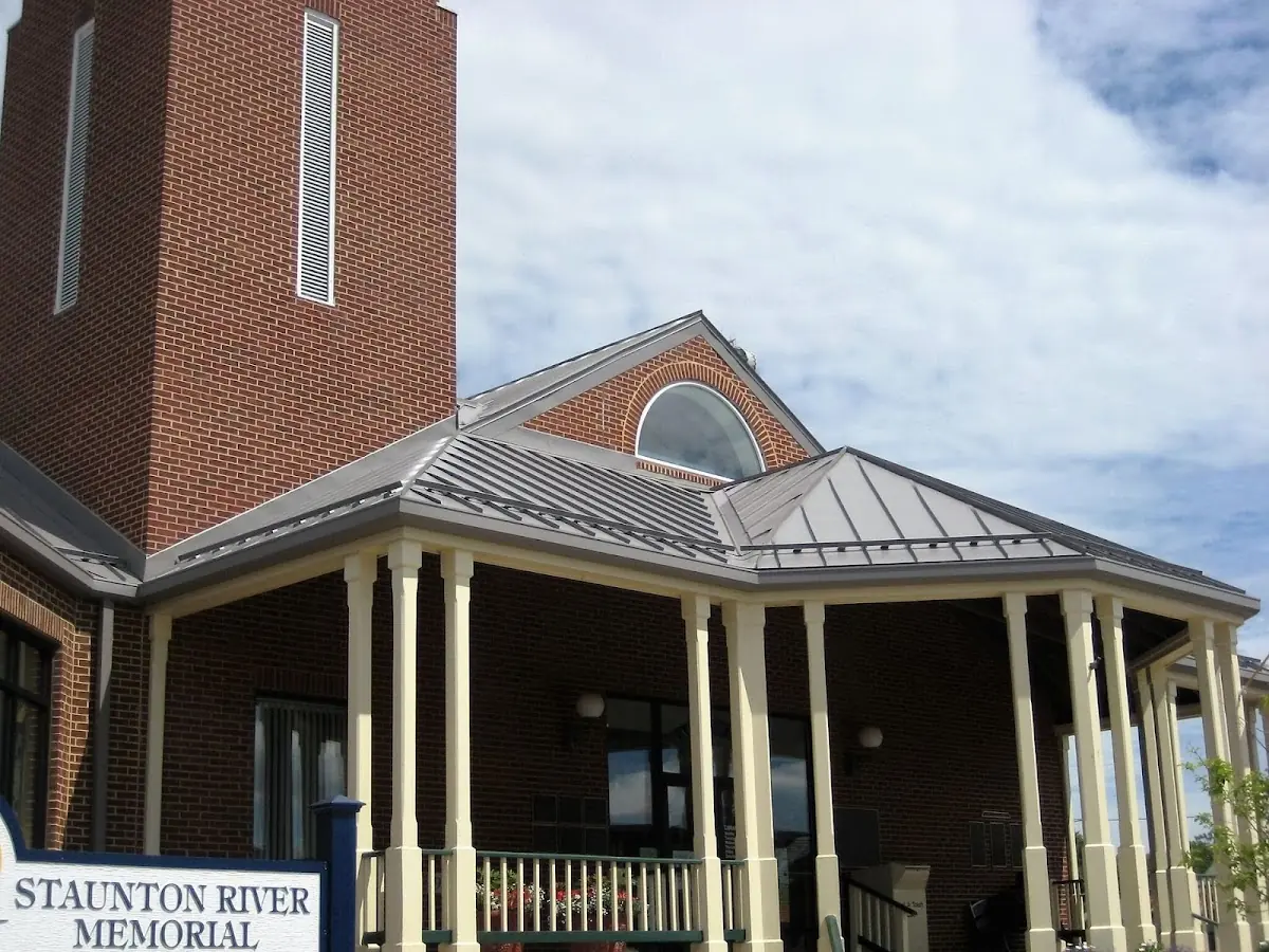 Skilled roofing craftsmen working on a residential roof in Brewton